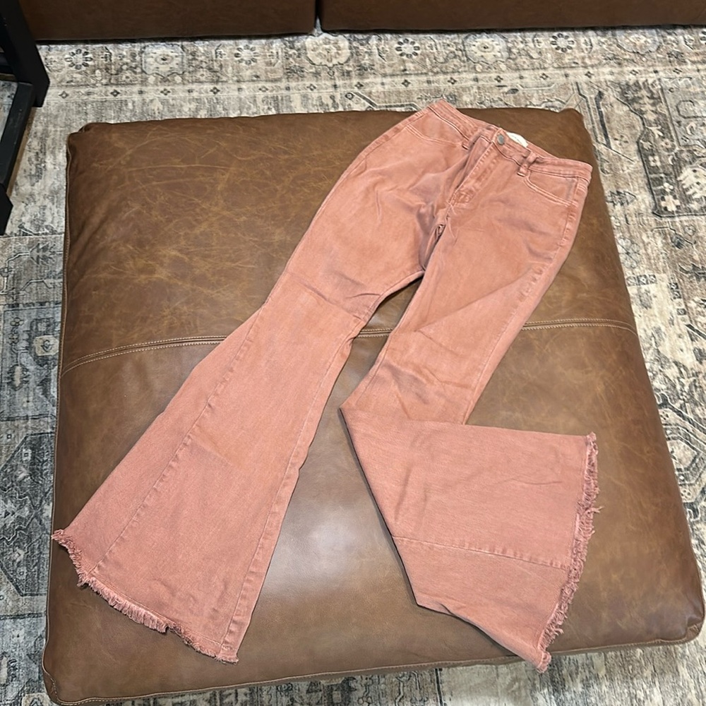 Blush colored flared jeans, size medium